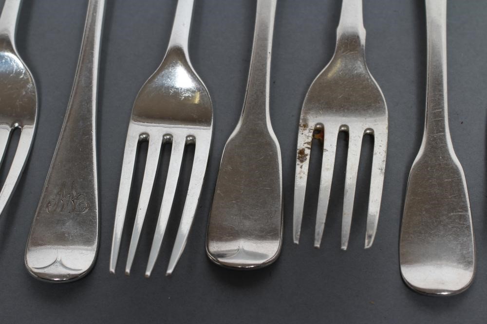 A MATCHED AND COMPOSITE SET OF SIX LATE GEORGE III DESSERT FORKS Image