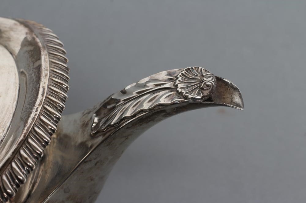 A LATE GEORGE III TEAPOT Image