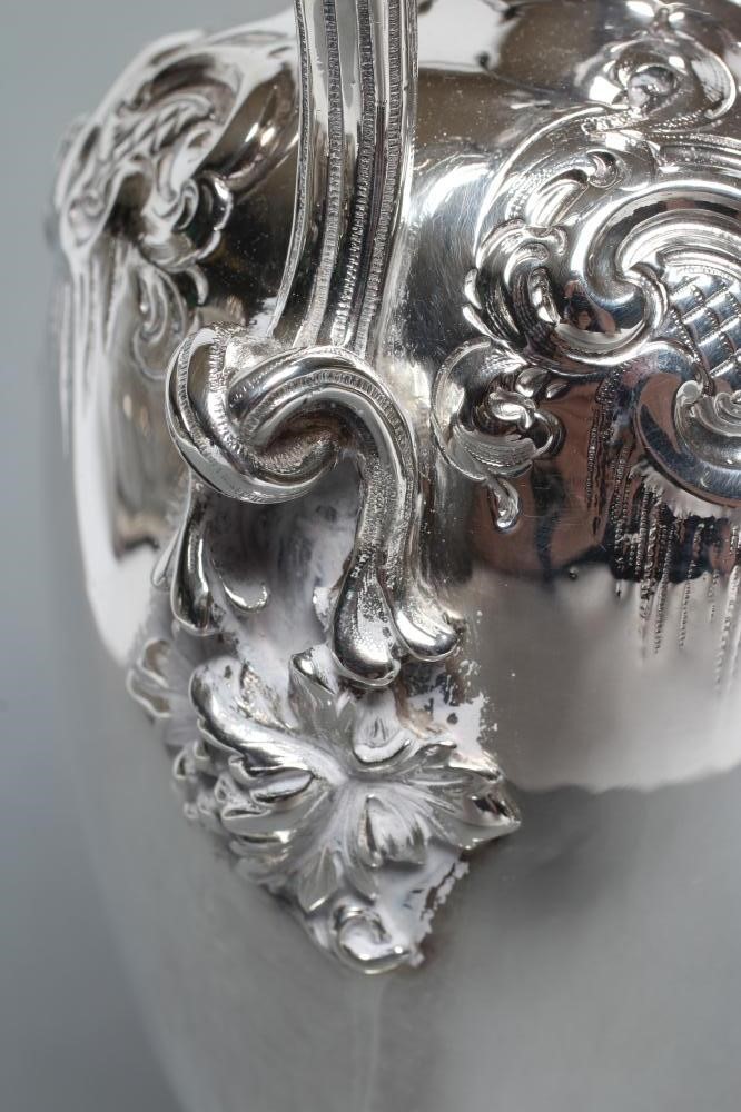 A MID VICTORIAN CLARET JUG Image