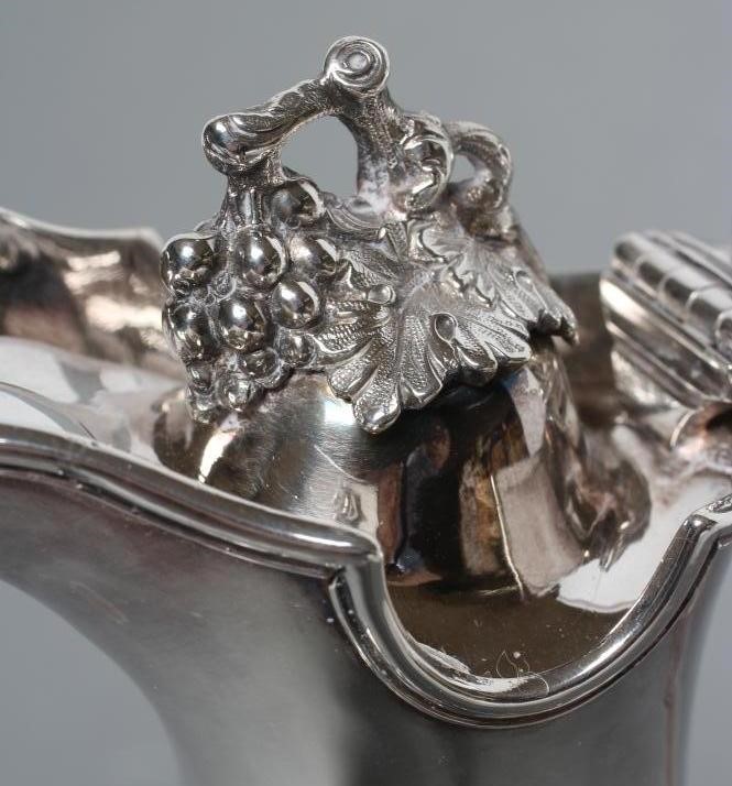 A MID VICTORIAN CLARET JUG Image