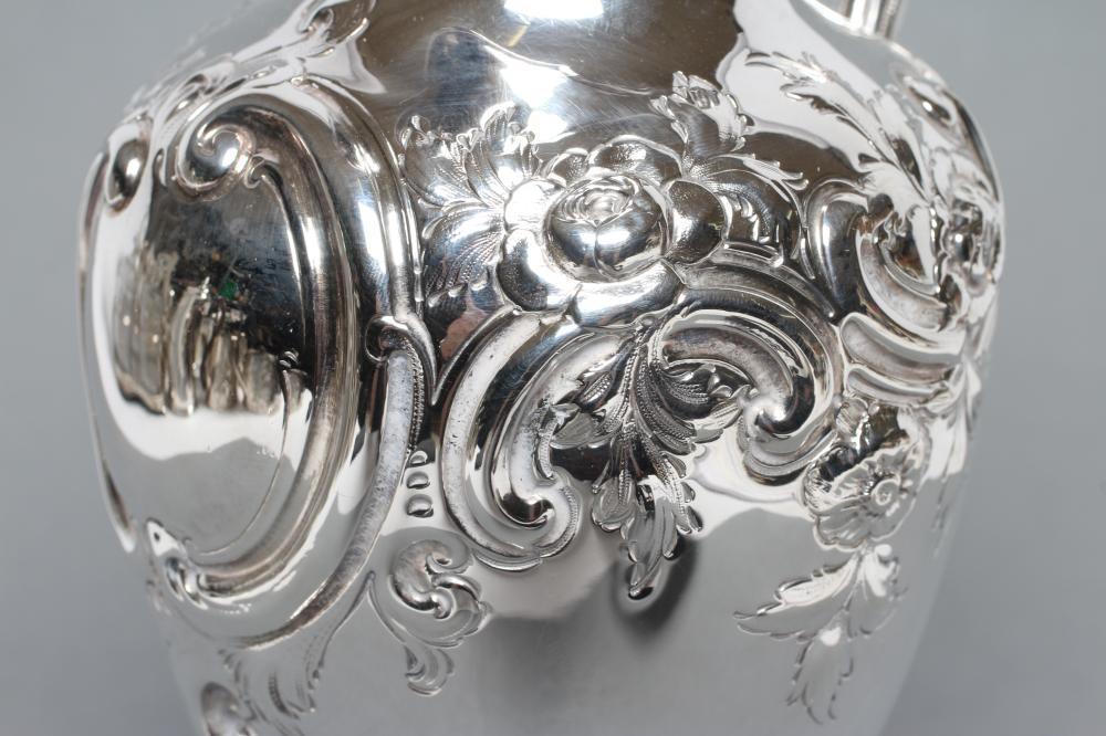 A MID VICTORIAN CLARET JUG Image