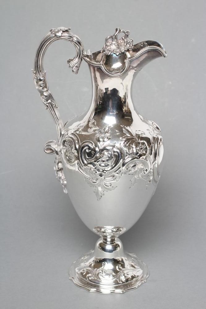 A MID VICTORIAN CLARET JUG Image