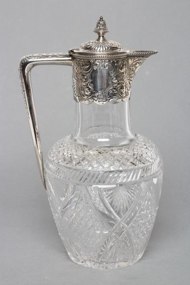 A LATE VICTORIAN GLASS CLARET JUG Image
