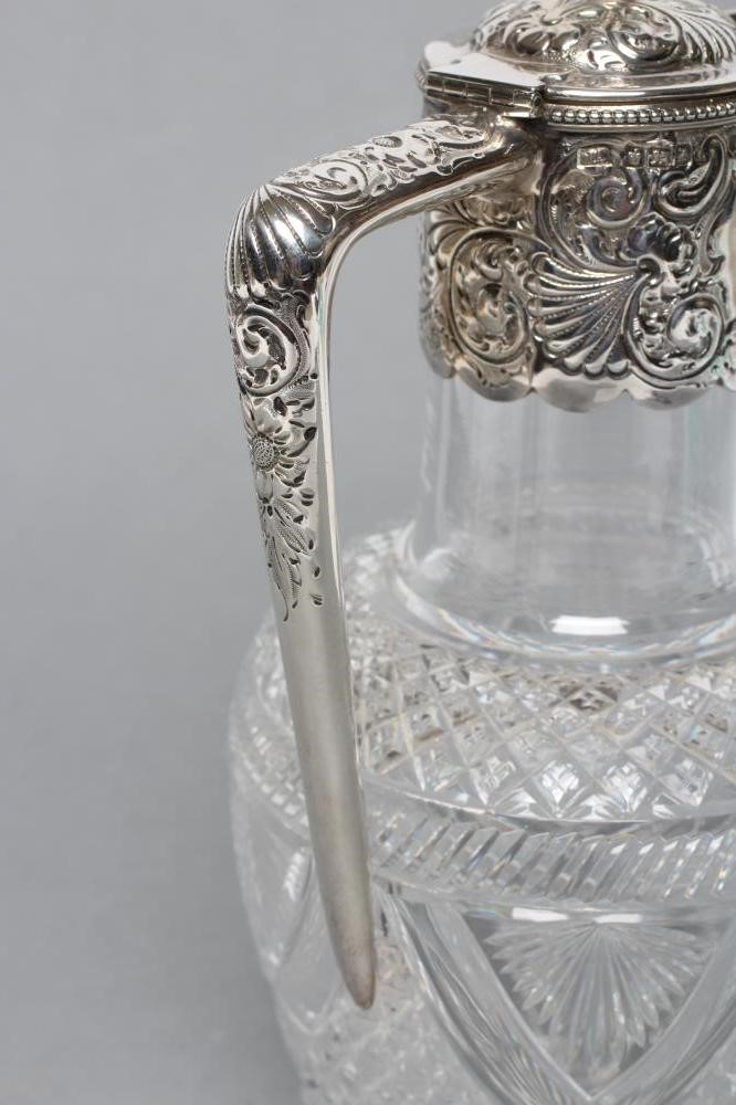 A LATE VICTORIAN GLASS CLARET JUG Image