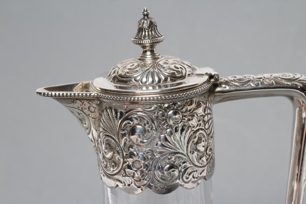 A LATE VICTORIAN GLASS CLARET JUG Image