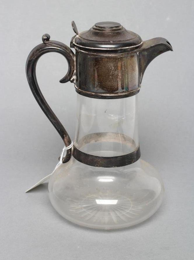 A LATE VICTORIAN GLASS CLARET JUG Image