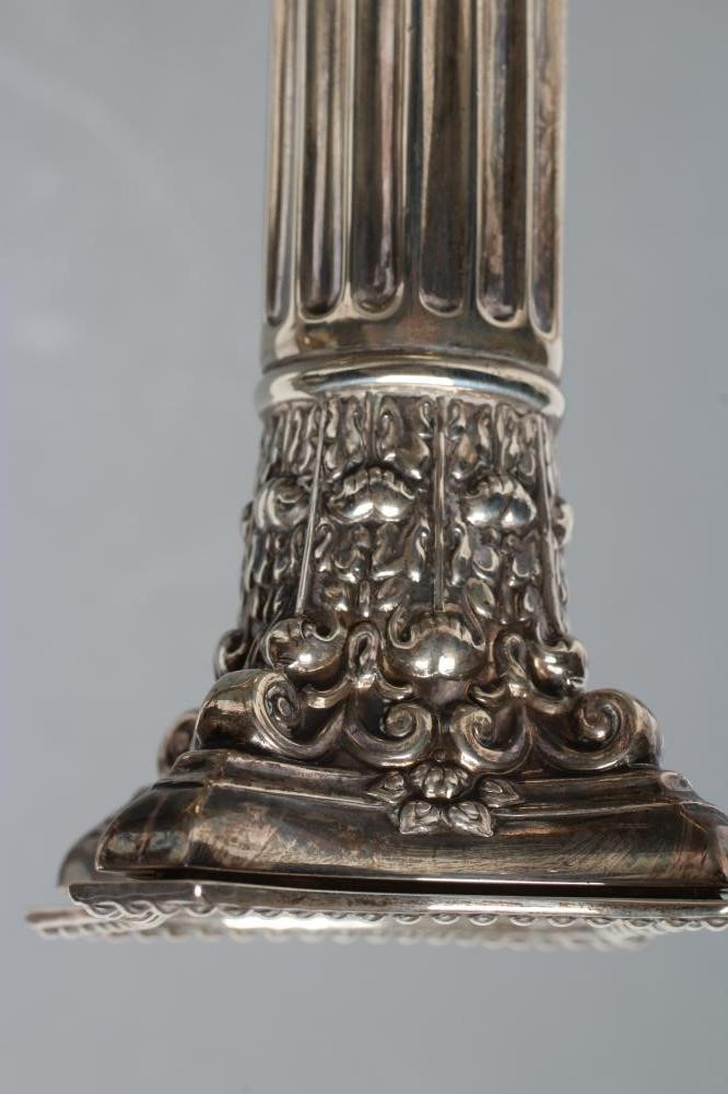 A COMPOSITE PAIR OF CORINTHIAN COLUMN CANDLESTICKS Image