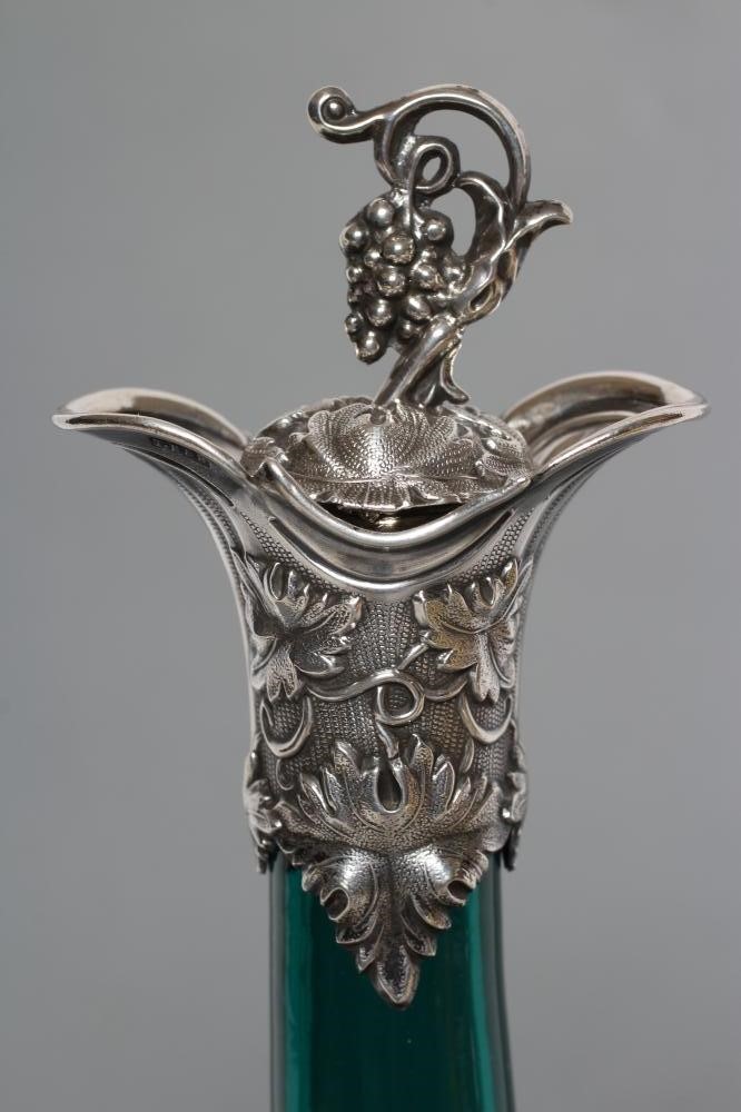 A PAIR OF VICTORIAN BRISTOL GREEN GLASS BOTTLE DECANTERS Image