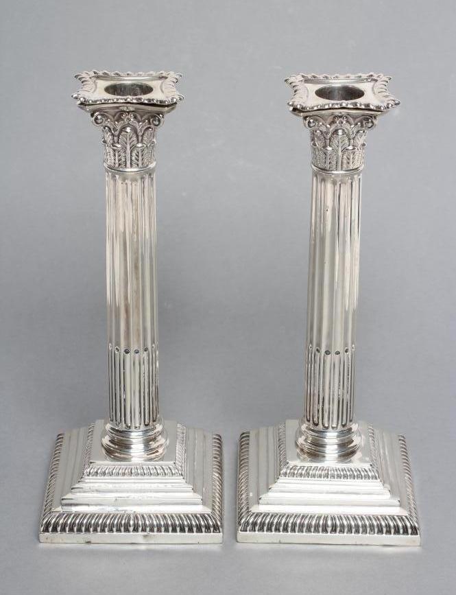 A PAIR OF LATE VICTORIAN CORINTHIAN COLUMN CANDLESTICKS Image