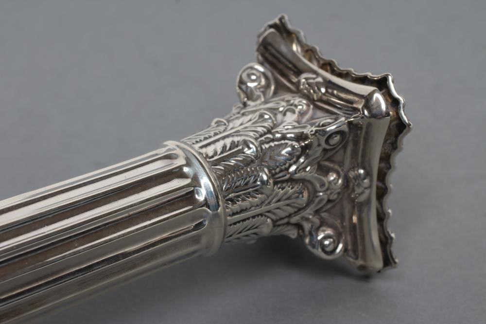 A PAIR OF LATE VICTORIAN CORINTHIAN COLUMN CANDLESTICKS Image