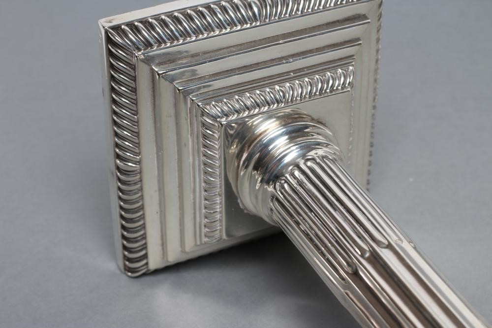 A PAIR OF LATE VICTORIAN CORINTHIAN COLUMN CANDLESTICKS Image