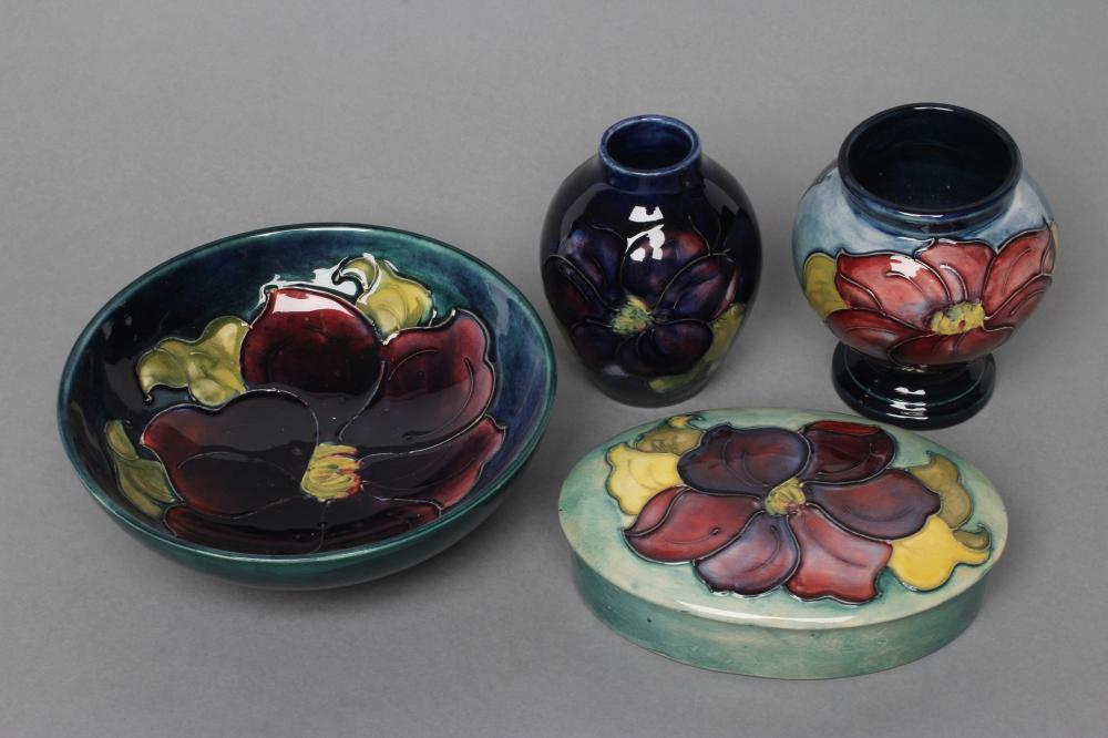 A COLLECTION OF MOORCROFT CLEMATIS PATTERN POTTERY Image