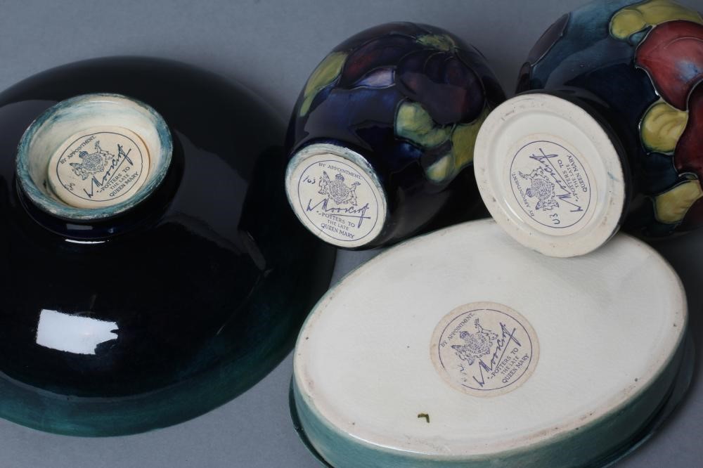 A COLLECTION OF MOORCROFT CLEMATIS PATTERN POTTERY Image