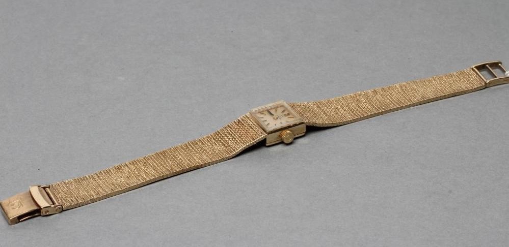 A LADY'S 9CT OMEGA WRISTWATCH Image