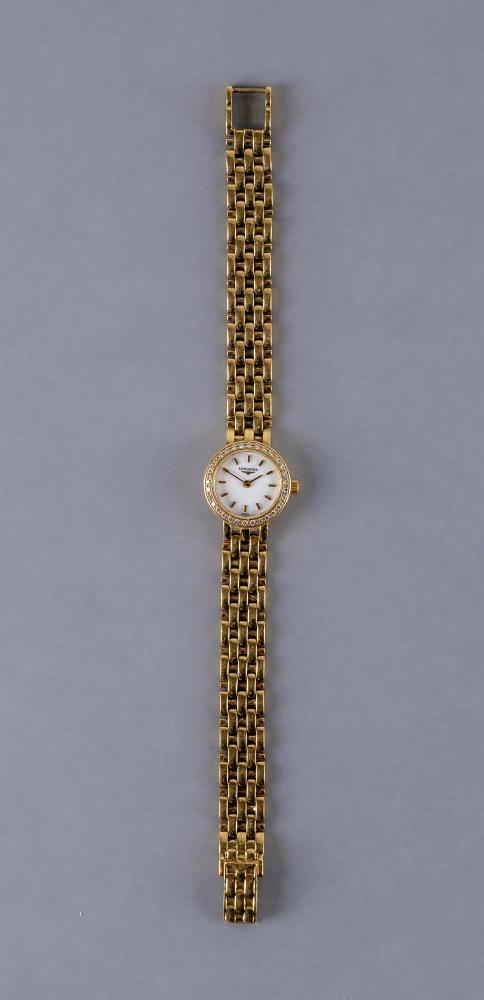 A LADY'S LONGINES 18CT GOLD AND DIAMOND WRISTWATCH Image