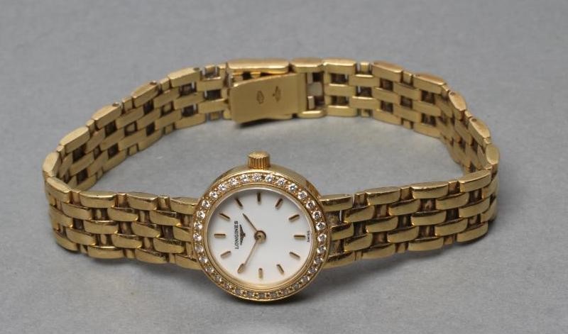 A LADY'S LONGINES 18CT GOLD AND DIAMOND WRISTWATCH Image