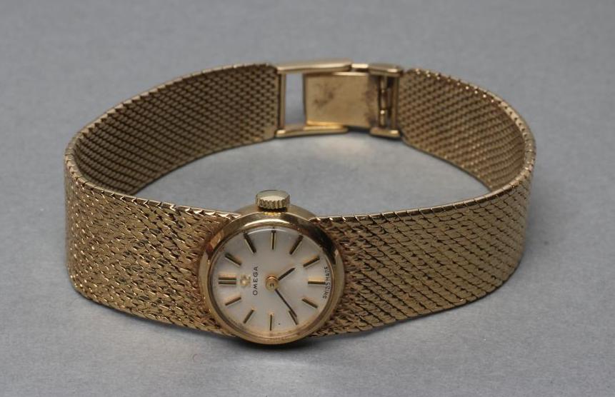 A LADY'S 9CT GOLD OMEGA WRISTWATCH Image
