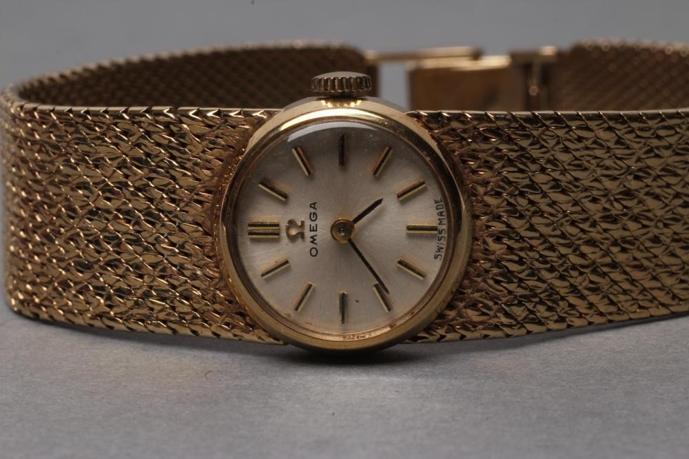 A LADY'S 9CT GOLD OMEGA WRISTWATCH Image