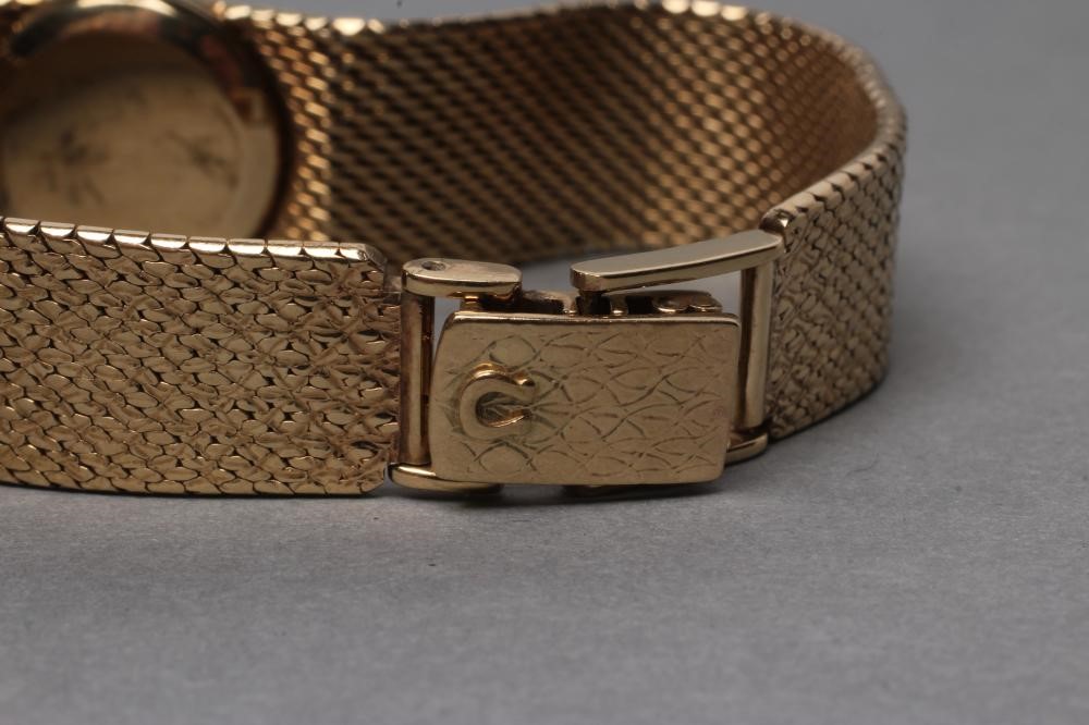 A LADY'S 9CT GOLD OMEGA WRISTWATCH Image