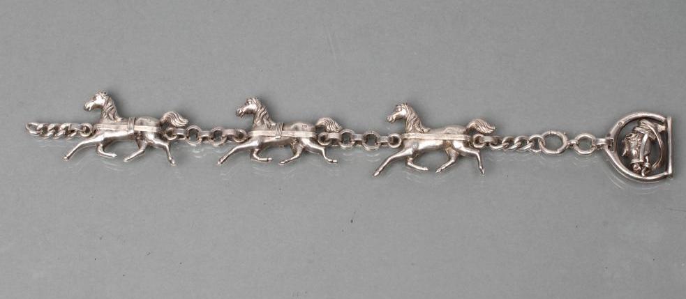 A HEAVY SILVER TRIPLE HORSE BRACELET Image