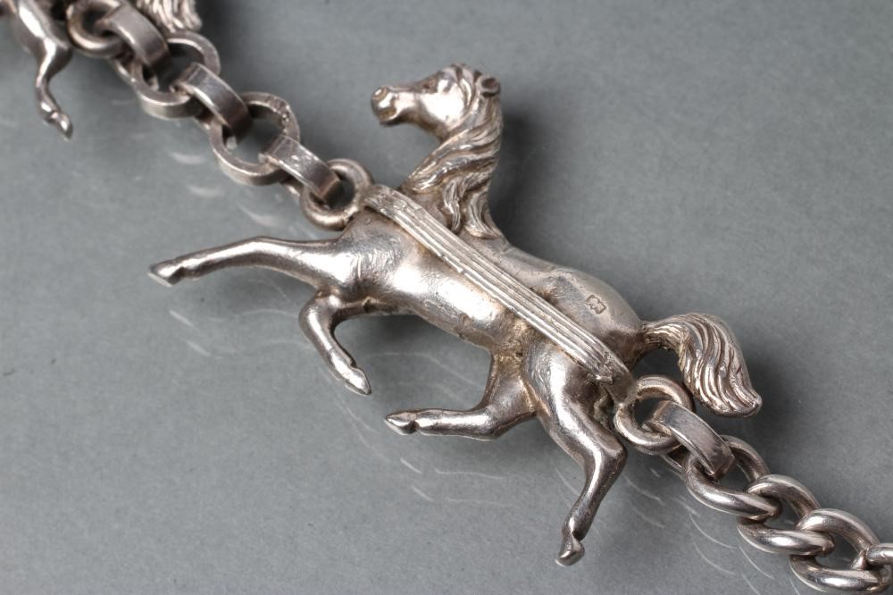 A HEAVY SILVER TRIPLE HORSE BRACELET Image