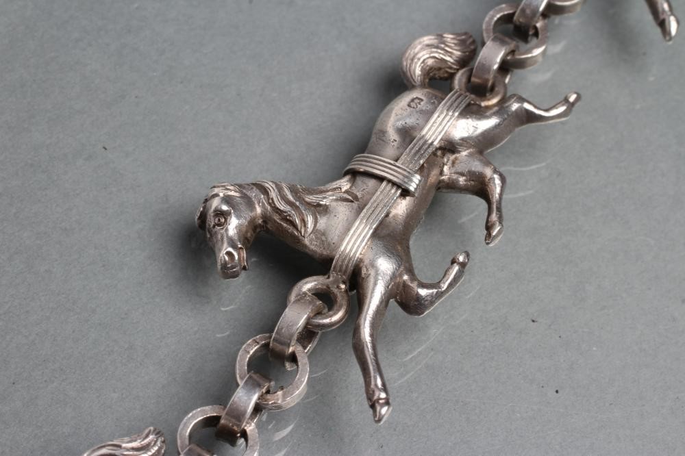 A HEAVY SILVER TRIPLE HORSE BRACELET Image