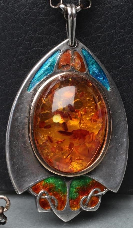 AN ARTS AND CRAFTS SILVER AND ENAMEL PENDANT Image