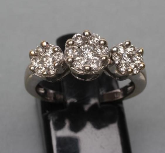 A DIAMOND TRIPLE CLUSTER RING Image