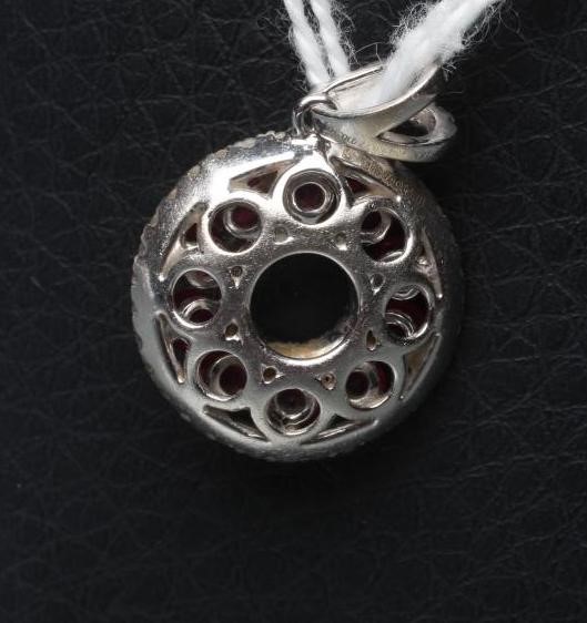 A RUBY AND DIAMOND "DOUGHNUT" PENDANT Image