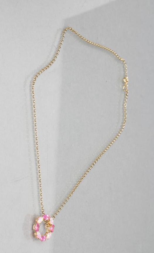 A PINK SAPPHIRE AND OPAL CIRCLET PENDANT claw set with four of each stones fixed to a 9ct gold chain Image