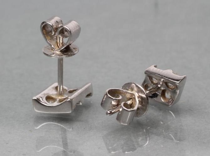 A PAIR OF DIAMOND EAR STUDS Image