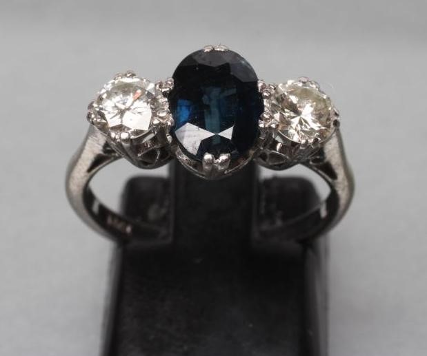 A SAPPHIRE AND DIAMOND THREE STONE RING Image