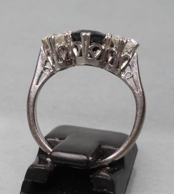 A SAPPHIRE AND DIAMOND THREE STONE RING Image