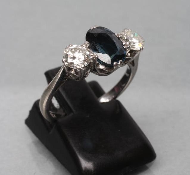 A SAPPHIRE AND DIAMOND THREE STONE RING Image