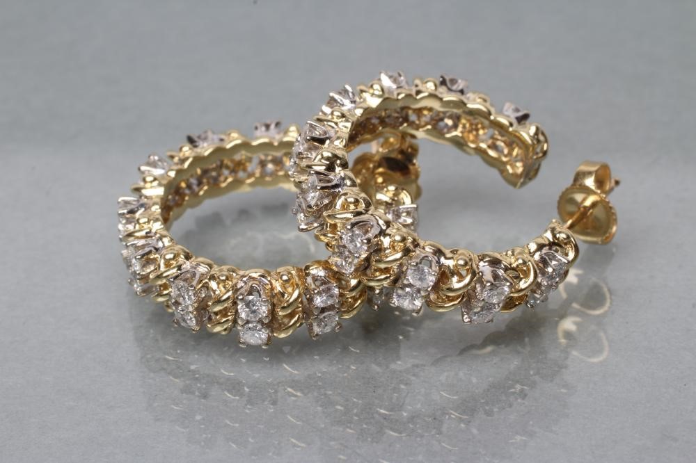 A PAIR OF DIAMOND HOOP EARRINGS Image