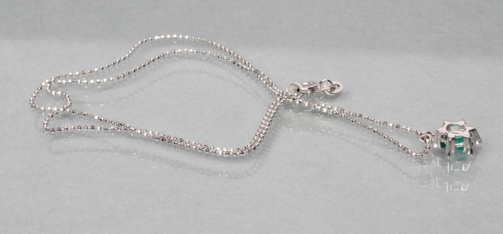 AN EMERALD AND DIAMOND PENDANT Image
