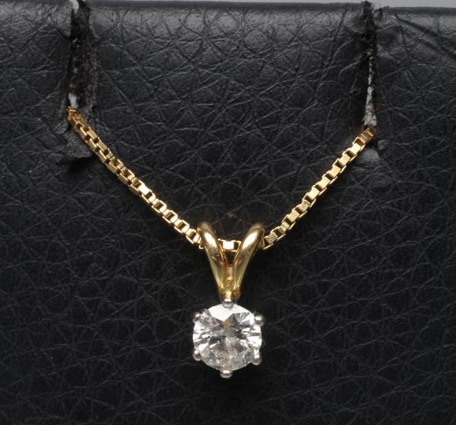 A SOLITAIRE DIAMOND PENDANT Image