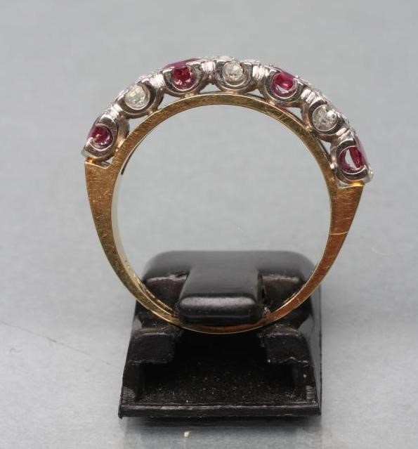 A RUBY AND DIAMOND HALF HOOP ETERNITY RING Image