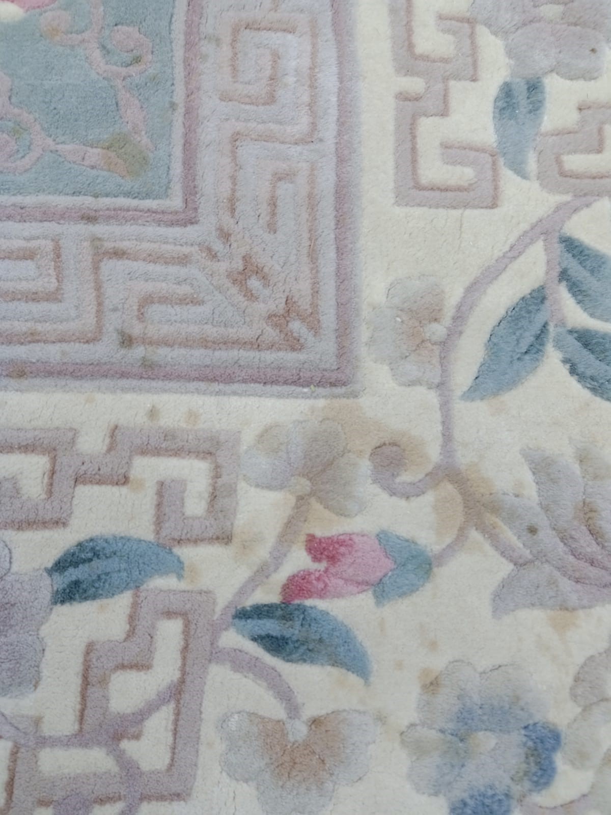 A CHINESE WASHED AND FRINGED CARPET Image
