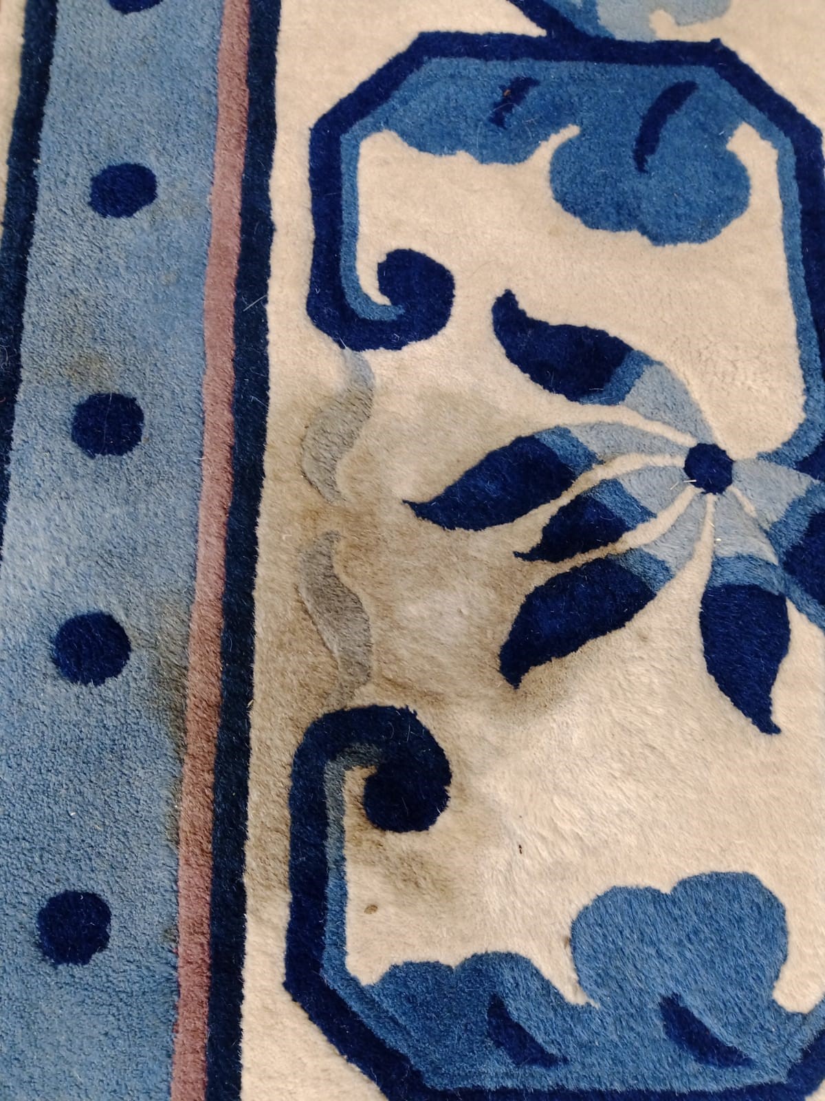 A CHINESE WASHED AND FRINGED CARPET Image