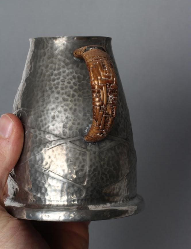 ARCHIBALD KNOX FOR LIBERTY - a Tudric pewter jug of tapering rounded cylindrical form Image