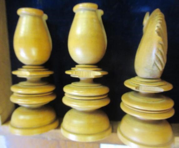 A TURNED WOOD CHESS SET in box and hardwood Image