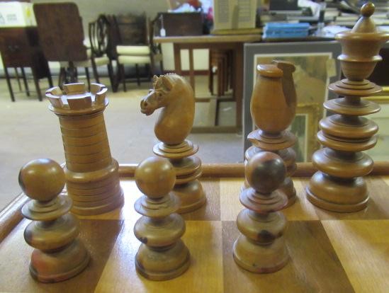 A TURNED WOOD CHESS SET in box and hardwood Image