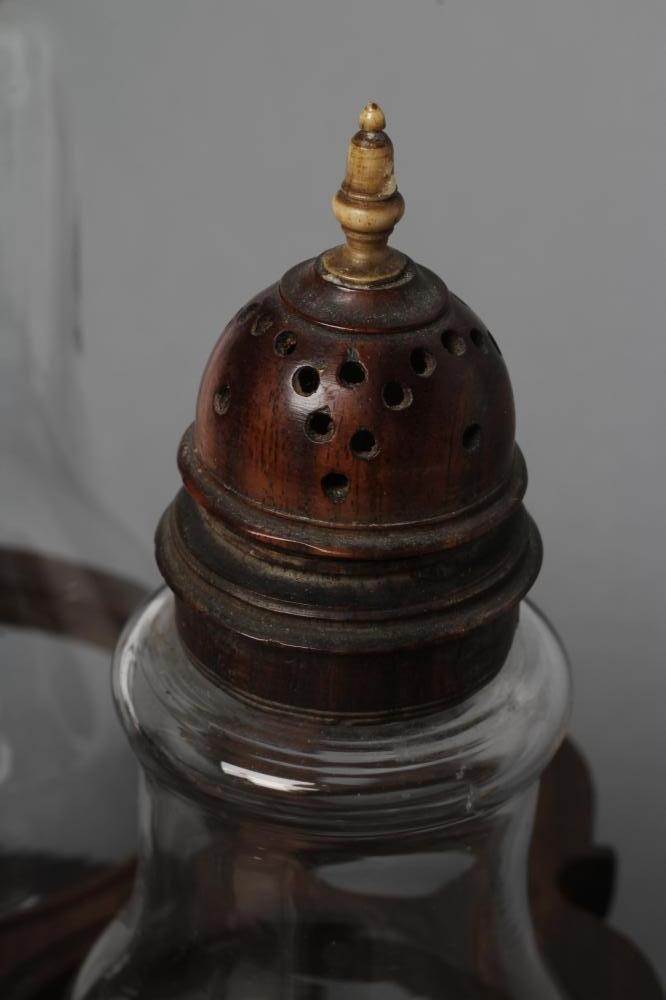 A GEORGIAN HARDWOOD FIVE BOTTLE CRUET AND STAND Image