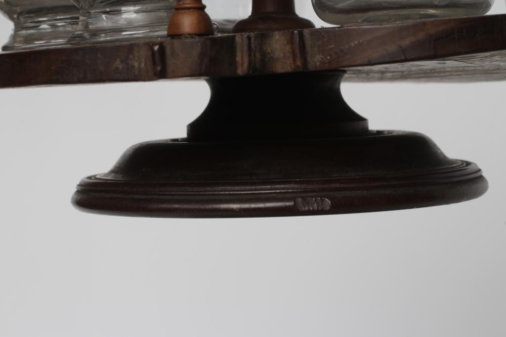 A GEORGIAN HARDWOOD FIVE BOTTLE CRUET AND STAND Image