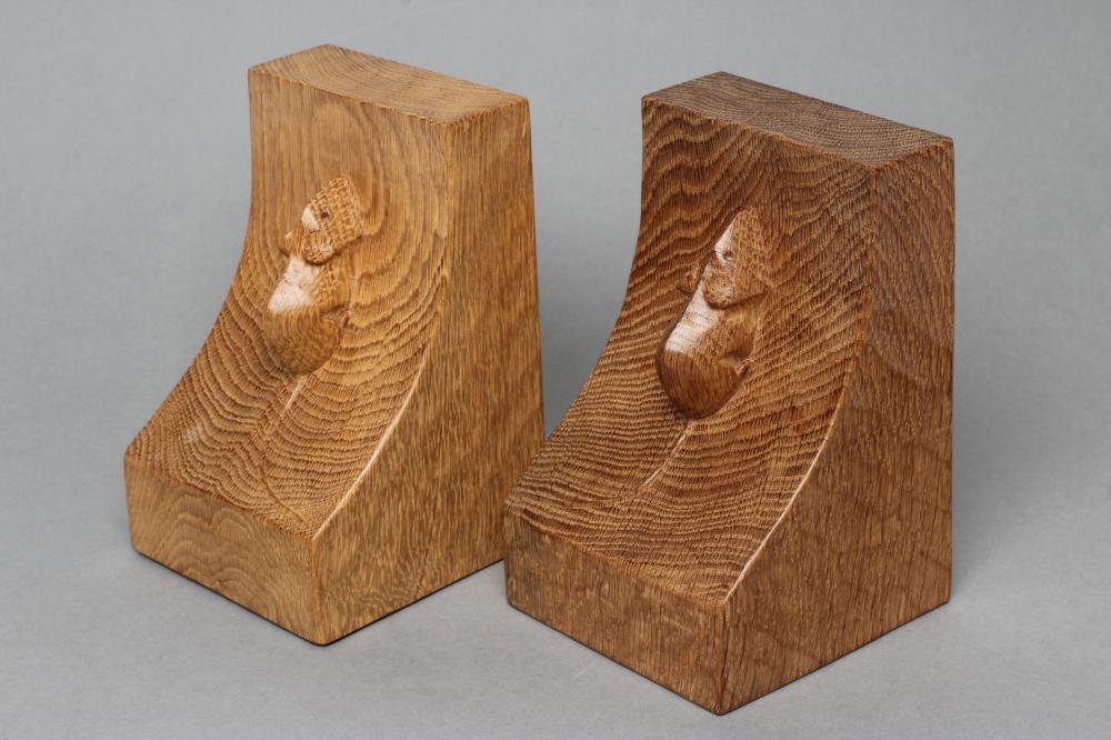 A PAIR OF ROBERT THOMPSON ADZED OAK BOOK ENDS of dished oblong form with carved mouse trademark in Image