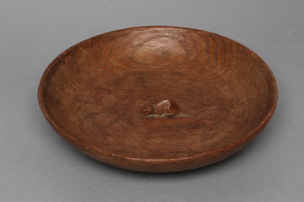 A ROBERT THOMPSON ADZED OAK BOWL of shallow circular form Image