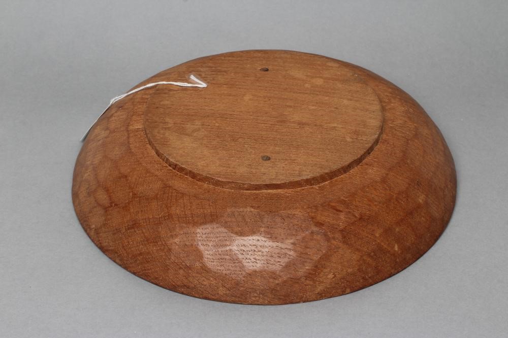 A ROBERT THOMPSON ADZED OAK BOWL of shallow circular form Image