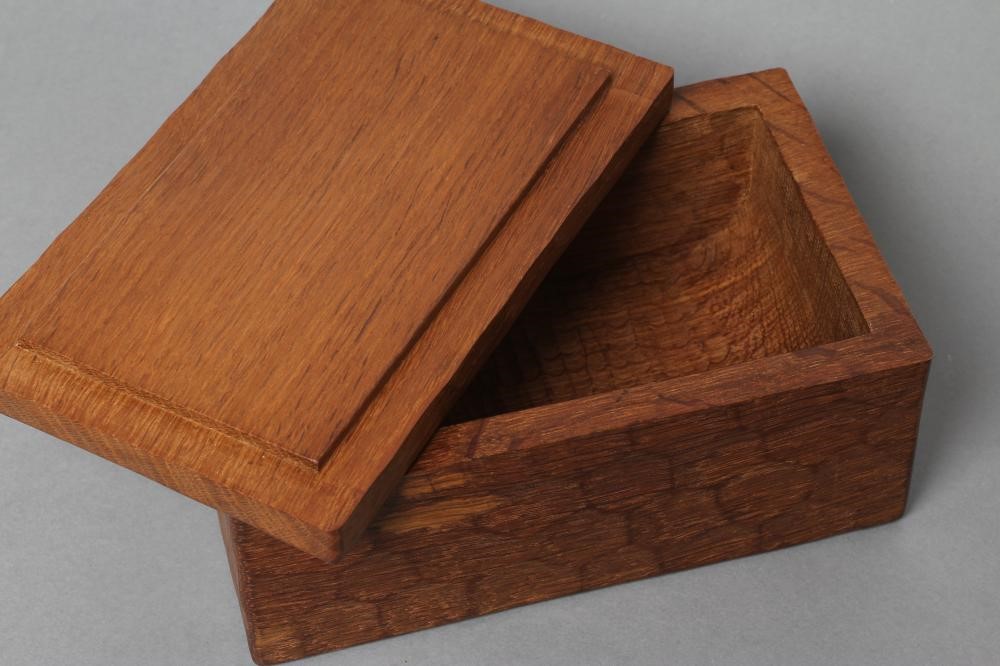 A ROBERT THOMPSON ADZED OAK TRINKET BOX of oblong form Image