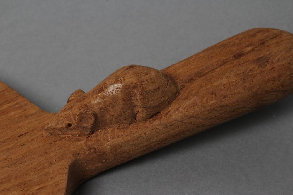 A ROBERT THOMPSON ADZED OAK CHEESE BOARD of oval form Image